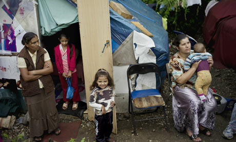 Roma women and children in a Lyon camp who stand to be expelled