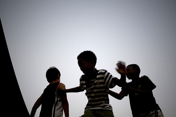 24 hours in pictures: Tel Aviv, Israel: Children of foreign migrant workers play