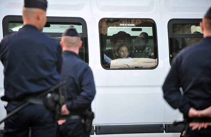 Roma deportation: People belonging to the Roma community wait in a bus