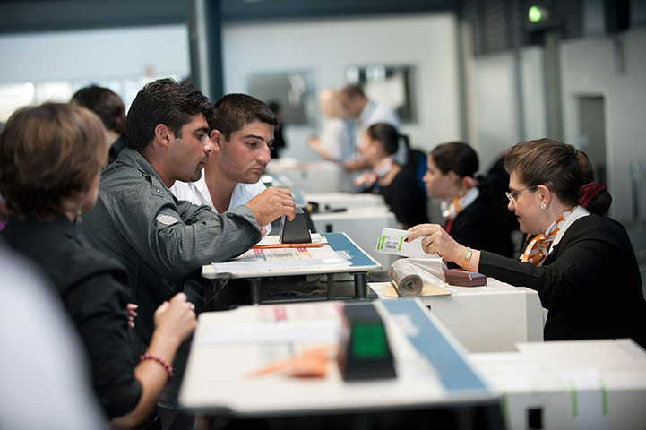 Roma deportation: Roma community check-in their baggage at Charles de Gaulle airport