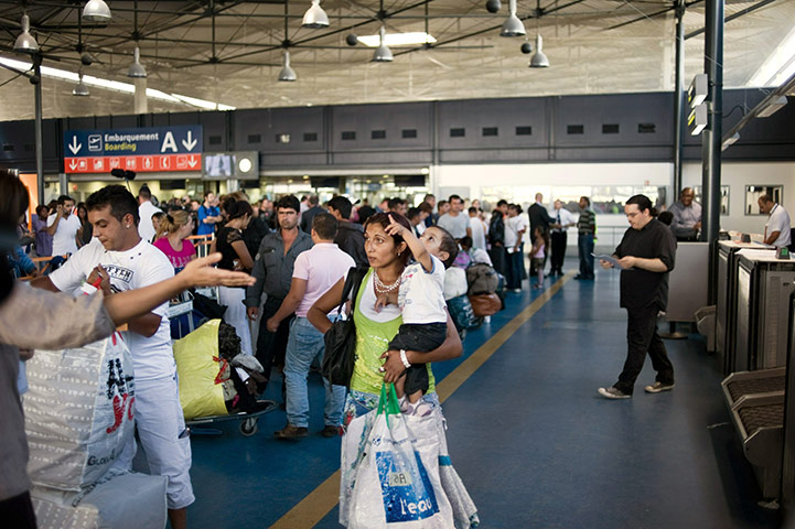 Roma deportation 2: Roma community arrive for boarding procedures at Charles de Gaulle airport