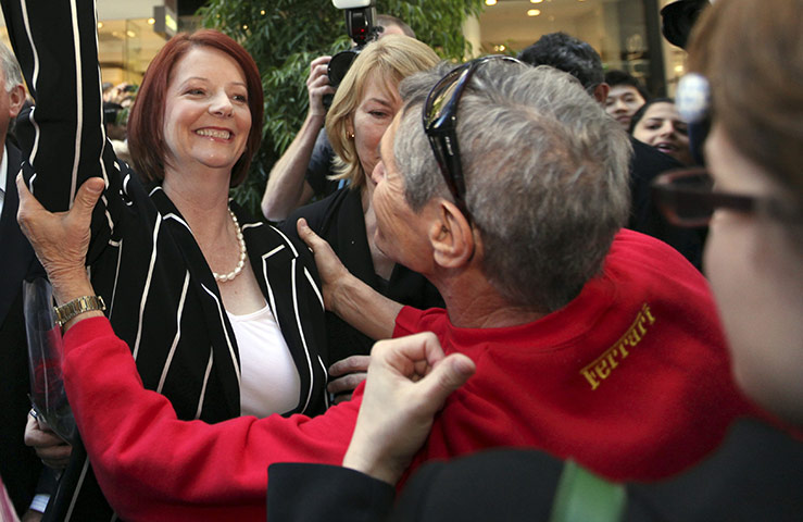Australia Election: A supporter embraces Australian Prime Minister Julia Gillard