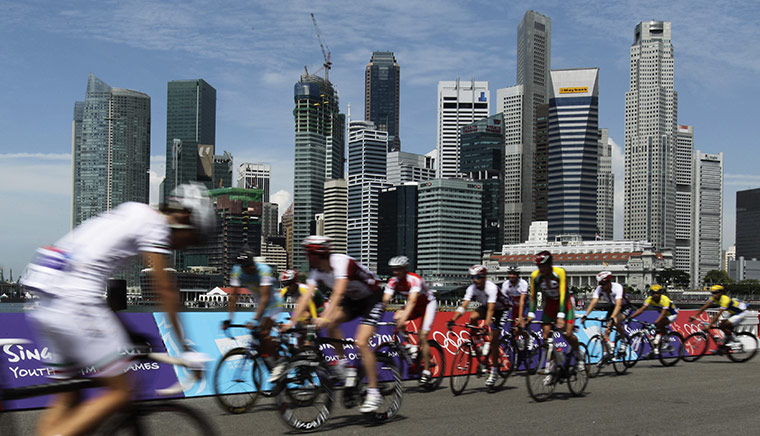 24 Hours in Pictures: Competitors warm up for the Youth Olympic Games in Singapore