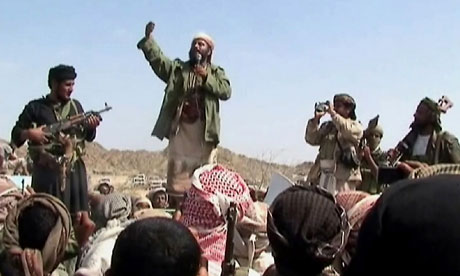 Armed men claiming to be al-Qaida members address a crowd in  Yemen's Abyan province