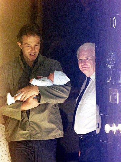 Cameron Baby Downing St: Tony Blair cradles his on Leo as they leave Downing Street