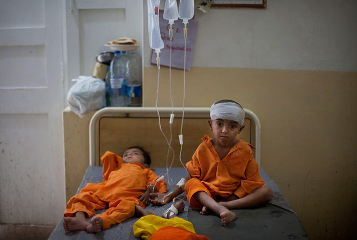 pakistan aftermath: Pakistani boys are treated at the pediatric ward of the hospital in Sukkar