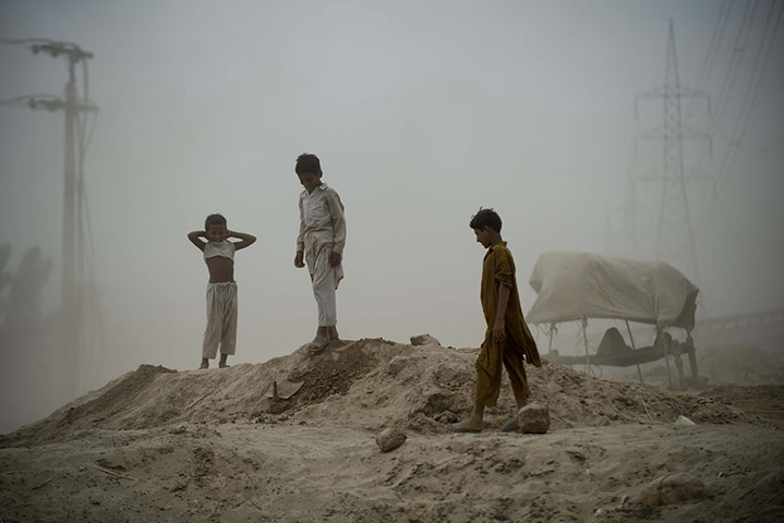 pakistan aftermath: Locals await relief goods after flooding in Muzaffargarh