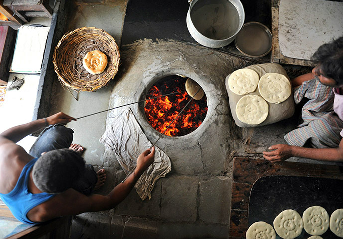 Ramadan Update: Indian Muslim bakers prepare a version of naan bread during Ramadan