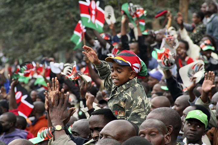 Kenya Constitution: A young boy reacts as Kenyans watch the signing of the new constitution