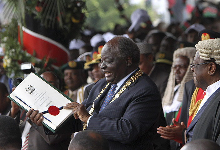 Kenya Constitution: President Mwai Kibaki displays the Oath of Due Execution of office