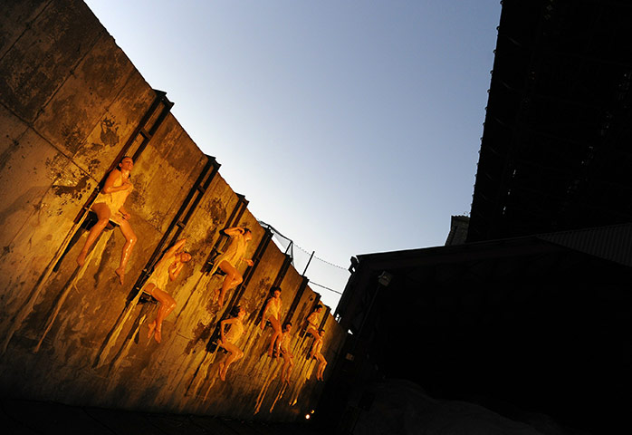 24 hours in pictures: Seven dancers are perched on a wall and