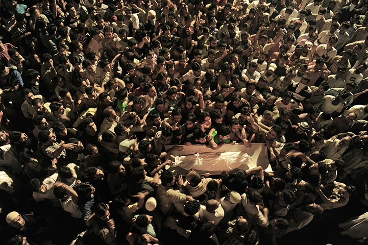 24 hours in pictures: funeral of nine-year-old boy  in kashmir