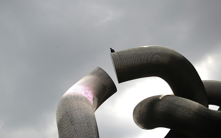 24 hours in pictures: A pigeon sits on a sculpture in Berlin