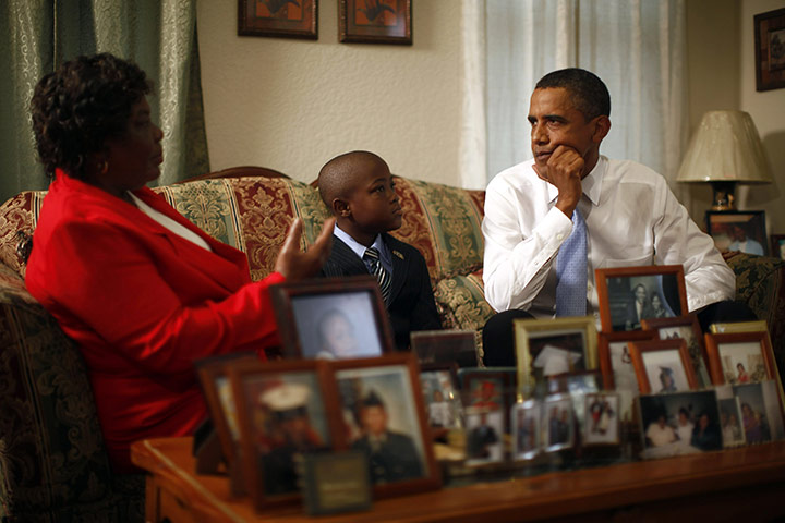 Obama in New Orleans: US President Barack Obama listens to Maude Smith and her grandson