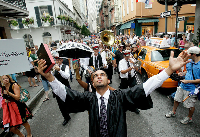 Obama in New Orleans: Jon-Devin Carrer dances along Royal Street in the French Quarter
