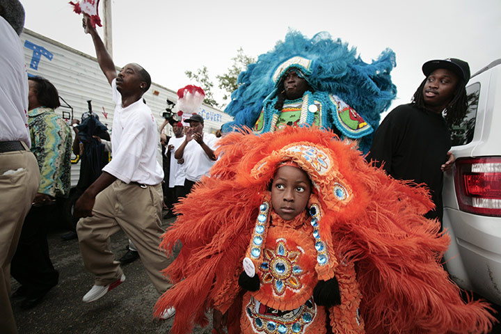 Obama in New Orleans: A young Mardi Gras Indian marches in a second line parade