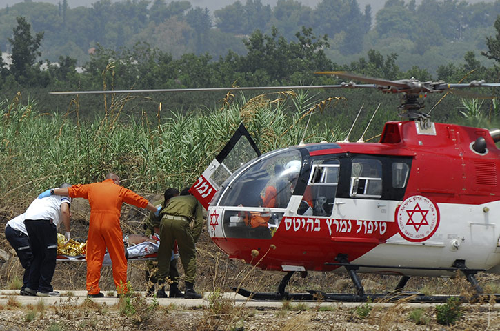 Israel and Lebanon clash: A wounded Israeli soldier is carried on a stretcher 