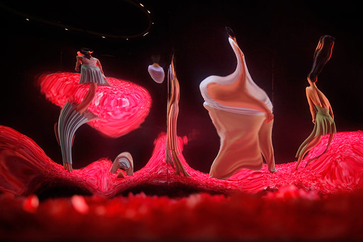 24 hours in pictures: Images of dancers are reflected in a mirror during a rehearsal