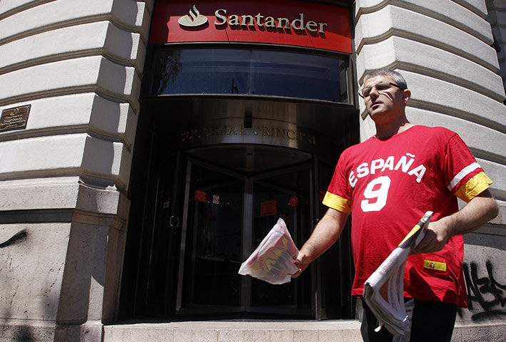 Week in business: A man walks past a branch of Eurozone biggest bank Santander in Madrid