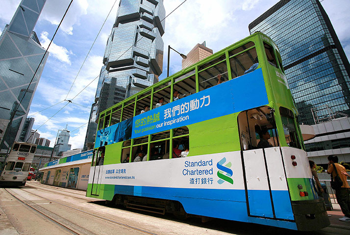 Week in business: A tram with a Standard Chartered bank advertisement in Hong Kong