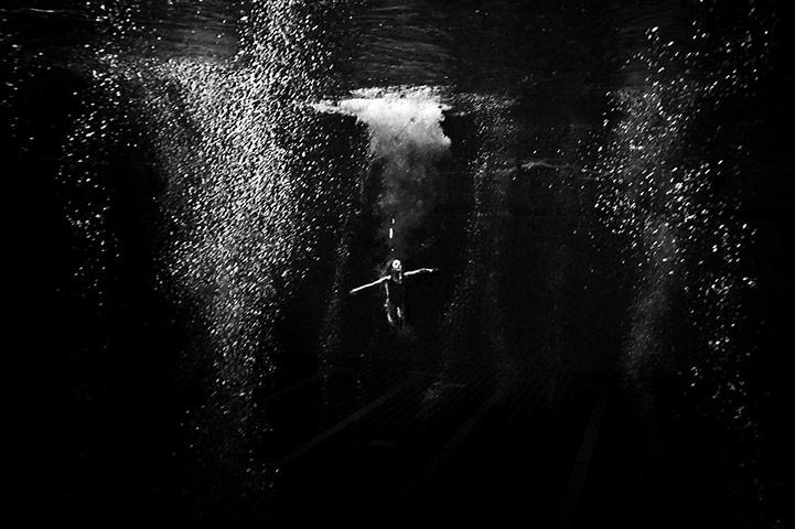 Diving: A diver enters the pool