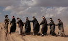 In this award-winning picture, detainees are led away for questioning during Operation Steel Curtain