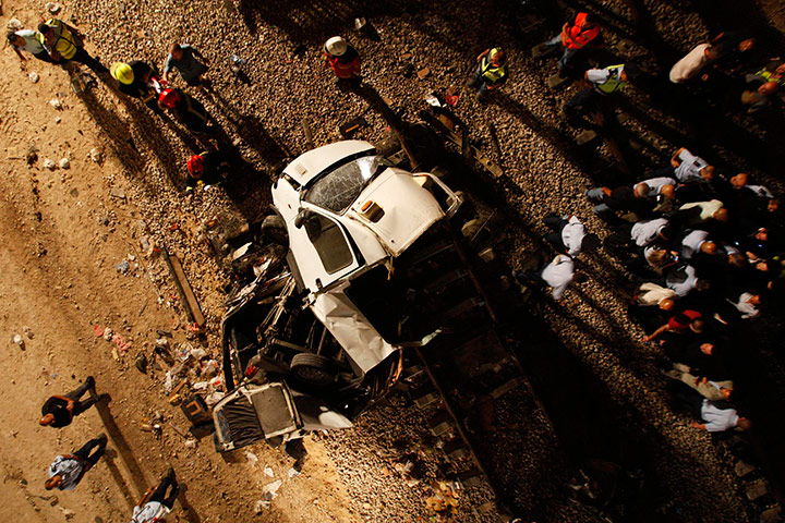 24 hours in pictures: The remains of a minibus lay on tracks near Kiryat Gat, Israel
