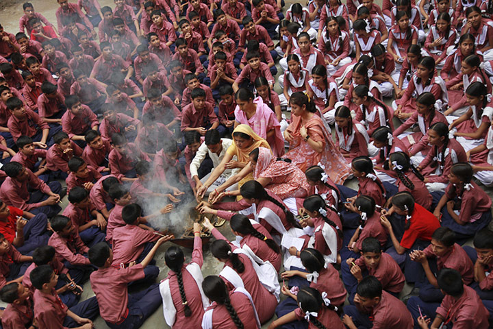 24 hours in pictures: Schoolchildren perform special prayers for victims of flash floods