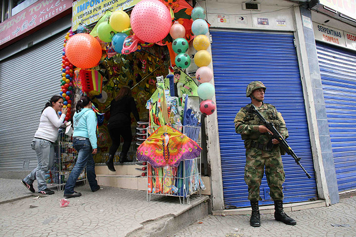 24 hours in pics: A soldier stands guard, Bogota, Colombia