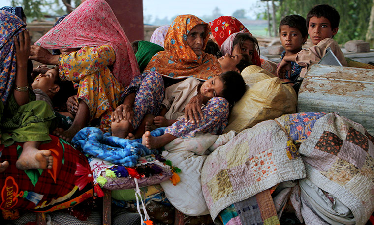 Pakistan update: Residents travel to safer place from a heavy flooded area of Toree Band