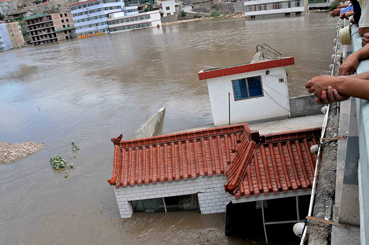 China Floods: Survivors wait for rescuers, after the floods, China.