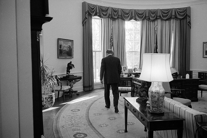 Oval Office redecoration: 1977: President Gerald Ford strides across the Oval Office