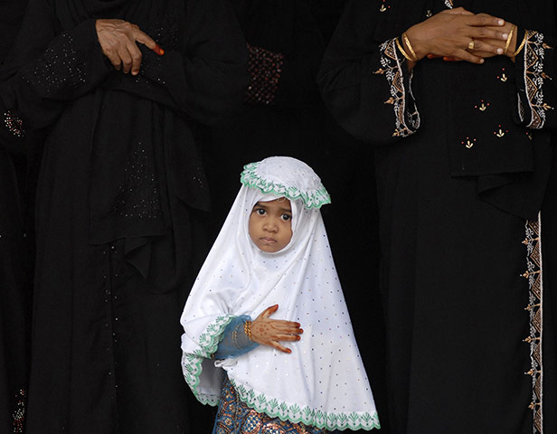 Eid begins: A Muslim girl attends Eid al-Fitr prayers at a school in Chennai, India
