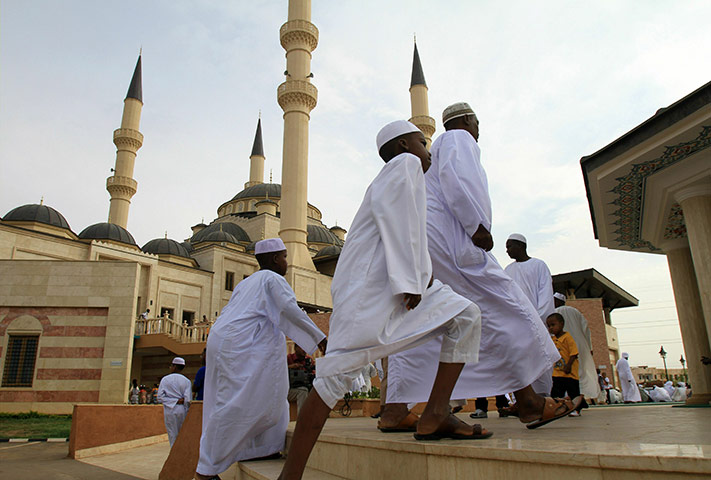 Eid begins: Sudanese men and children arrive for Eid Al-Fitr prayer in Omar Al-Mukhtar 