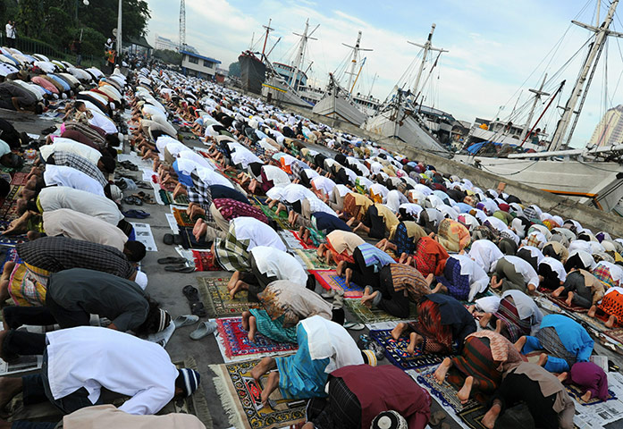 Eid begins: Hundreds of Indonesian Muslims perform the Eid al-Fitr prayer