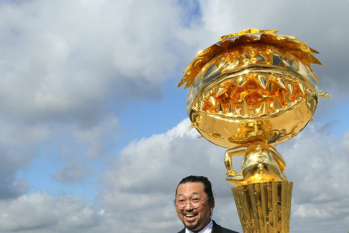 Murakami at Versailles: Japanese artist Takashi Murakami poses in front of Oval Buddha Gold