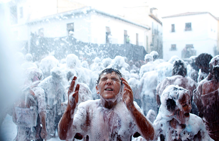 24 hours in pictures: A reveller washes his face during the annual Cascamorras festival in Guadix