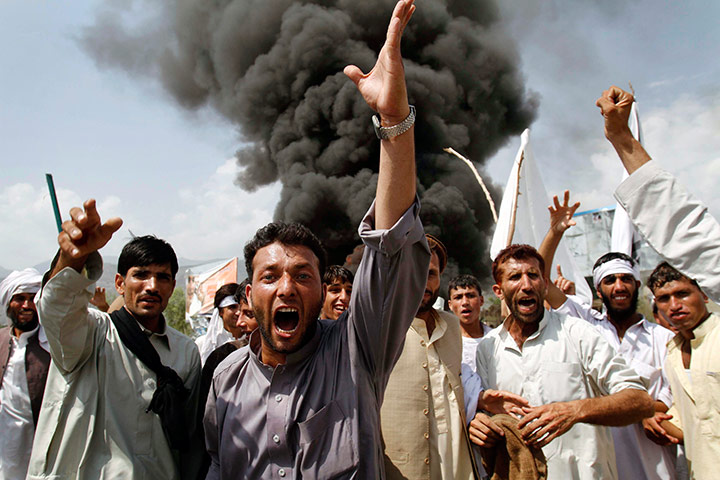 24 hours in pictures: Afghans shout anti-US slogans as they burn tires