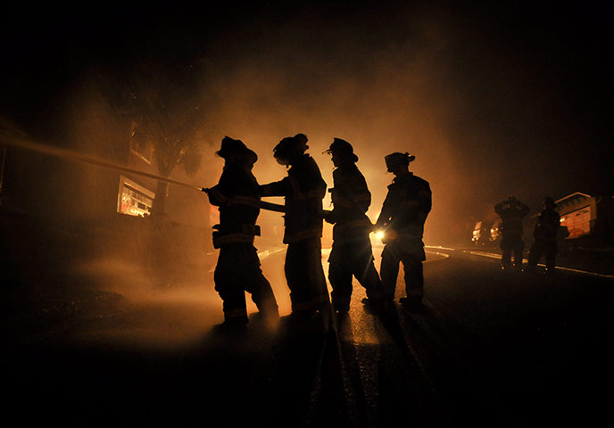 San Bruno fire: Firemen attempt to put out a blaze in San Bruno, close to San Francisco