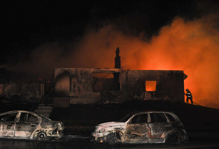 San Bruno fire: A lone fireman near a burned out house after a massive explosion 