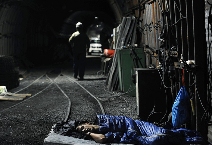 24 Hours: A coal miner rests during the eighth day of a sit-in protest