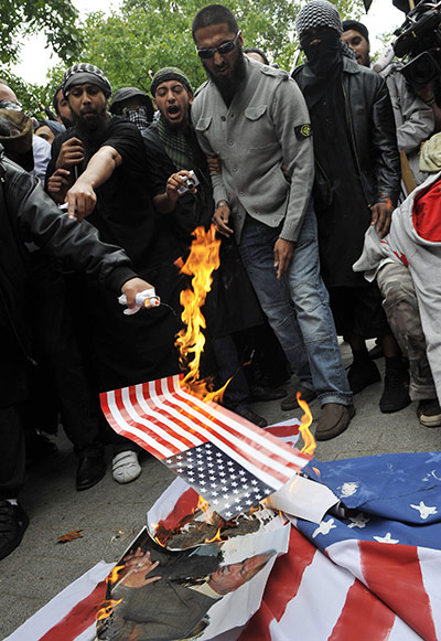 World Trade: Muslims Protest Burn US Flag Outside US Embassy