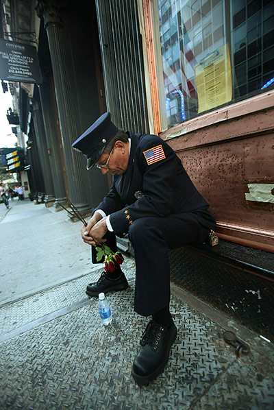 9/11 update: Firefighter Hassan Hamza bows his head after 9/11 commemorations