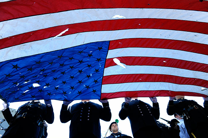 9/11 update: New York City Honor Guard carry a flag found at Ground Zero
