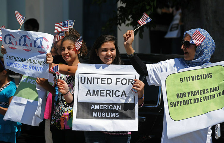 9/11 update: Girls hold signs at the 9/11 Interfaith Peace Vigil