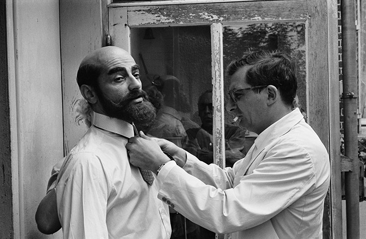 Claude Chabrol: 1962: Claude Chabrol tidies up actor Charles Denner during 'Landru'