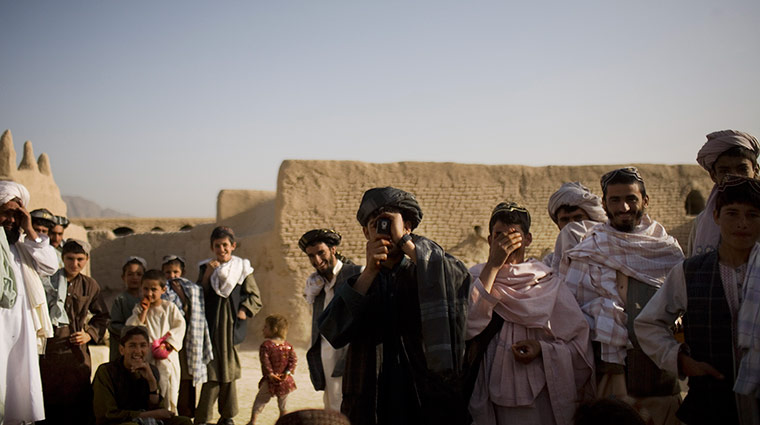 24 hours in pictures: Afghan men take pictures of Canadian soldiers