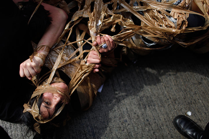 24 hours in pictures: Theatre company performs at a march in Santiago, Chile