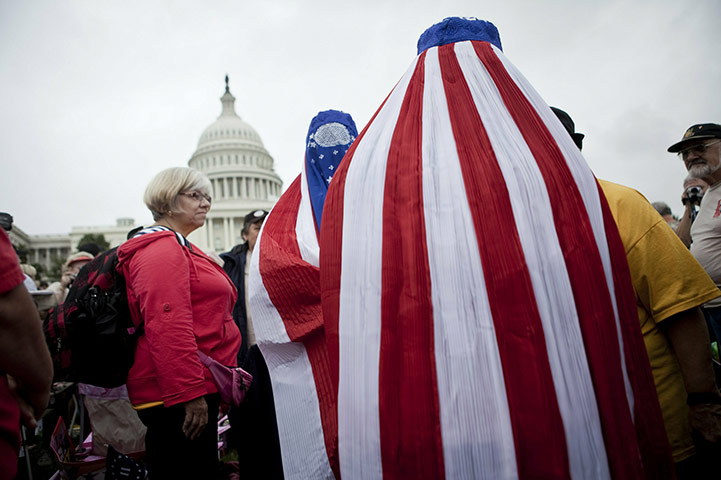 24 hours in pictures: Women dressed in American flag burkas during a rally in Washington 