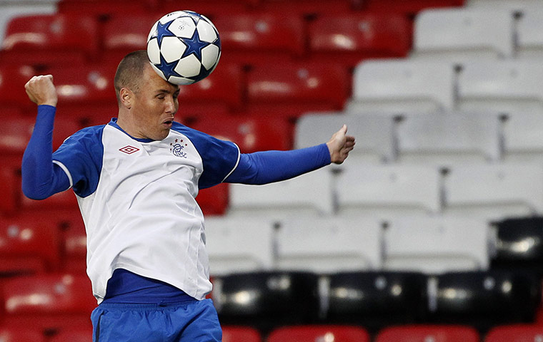 24 hours in sport: Rangers' Miller heads a ball during a training session